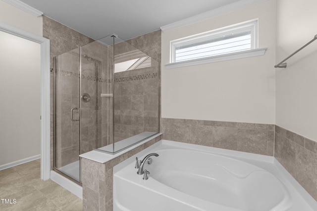 bathroom with ornamental molding and separate shower and tub