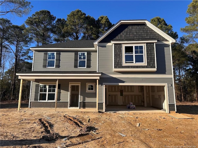 view of front of home featuring a garage and covered porch