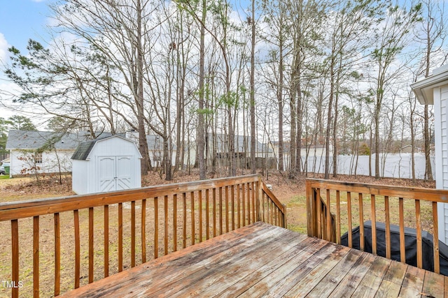 wooden terrace with a shed and an outdoor structure