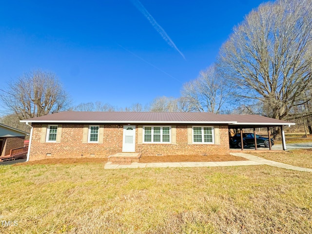 single story home featuring a front lawn and a carport