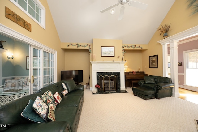 living room with ceiling fan, high vaulted ceiling, decorative columns, carpet, and a fireplace