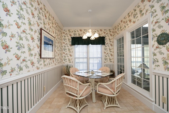 tiled dining space featuring crown molding and a notable chandelier