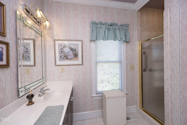 bathroom featuring vanity, a shower with shower door, and tile patterned flooring