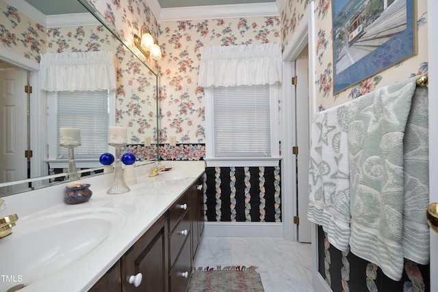 bathroom featuring ornamental molding and vanity