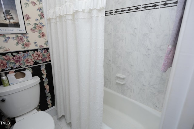 bathroom featuring shower / bath combination with curtain and toilet