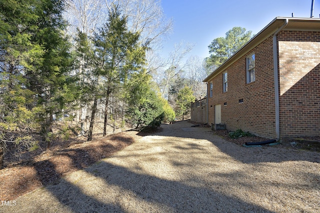 view of side of property with central AC unit