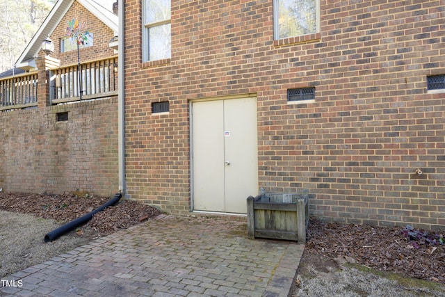 property entrance featuring a patio area