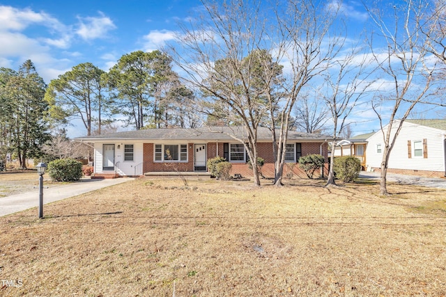 ranch-style home featuring a front yard