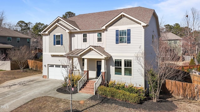 craftsman inspired home featuring an attached garage, roof with shingles, fence, board and batten siding, and driveway