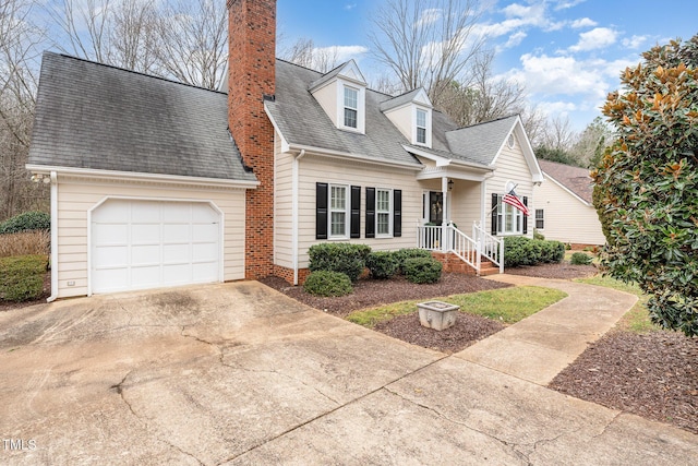 new england style home featuring a garage