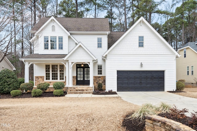 view of front of property with french doors and a garage