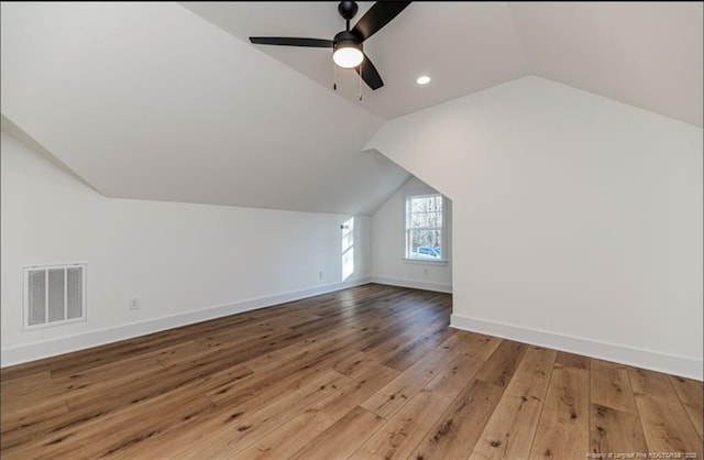 bonus room featuring wood-type flooring, vaulted ceiling, and ceiling fan