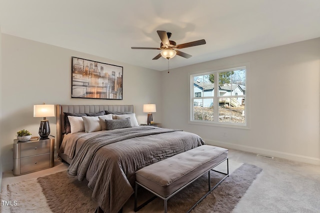 carpeted bedroom with ceiling fan