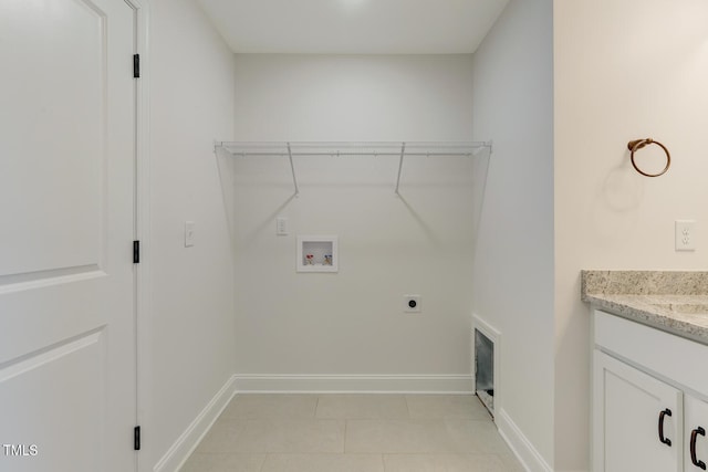 washroom featuring washer hookup, light tile patterned floors, and hookup for an electric dryer