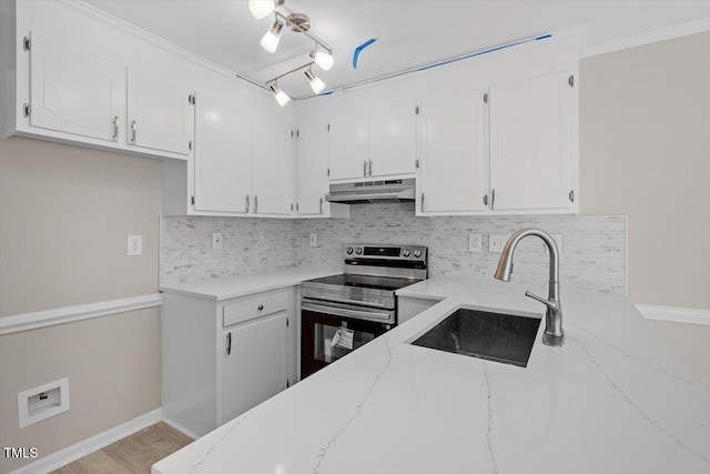 kitchen featuring white cabinetry, sink, backsplash, electric range, and light stone counters