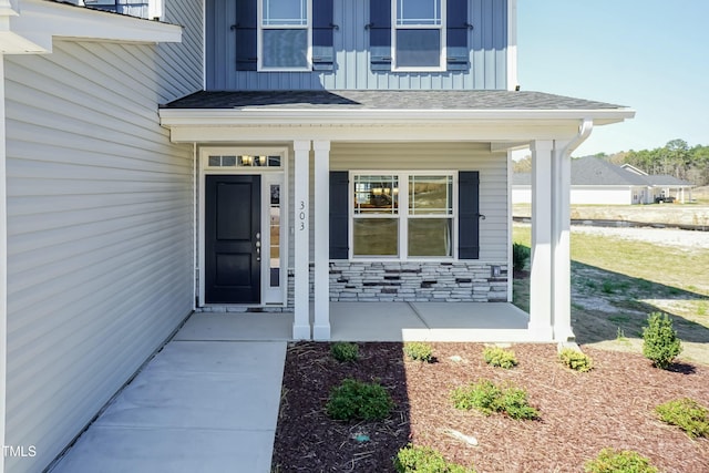 view of exterior entry featuring a porch