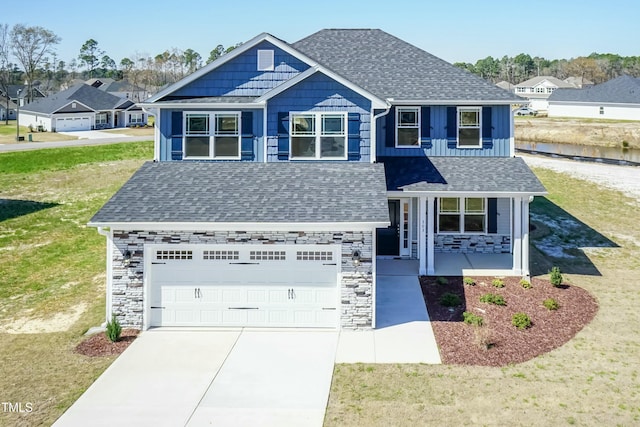 view of front of home with a porch and a front yard