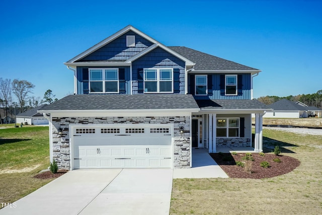 view of front of property with a garage and a front lawn