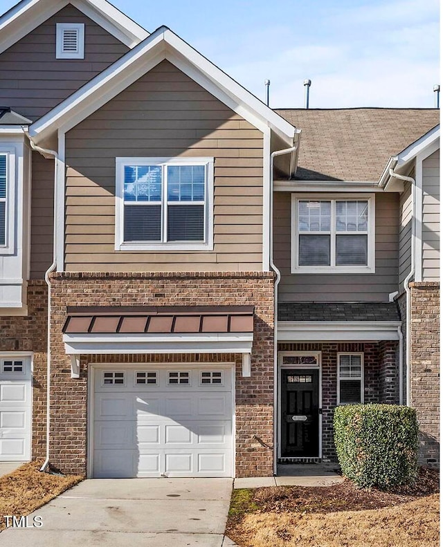 view of front of property with a garage