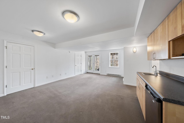 kitchen featuring dishwasher, dark countertops, a baseboard radiator, dark carpet, and a sink