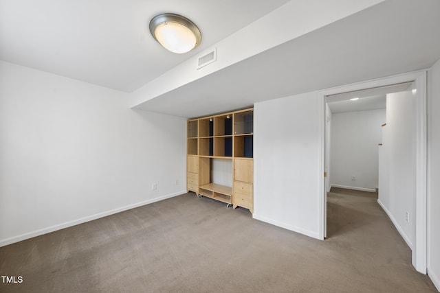 unfurnished bedroom with baseboards, visible vents, and carpet flooring