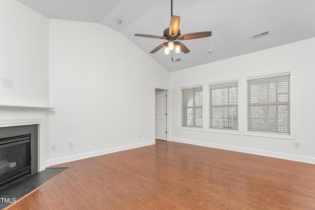 unfurnished living room featuring ceiling fan, dark hardwood / wood-style flooring, and high vaulted ceiling