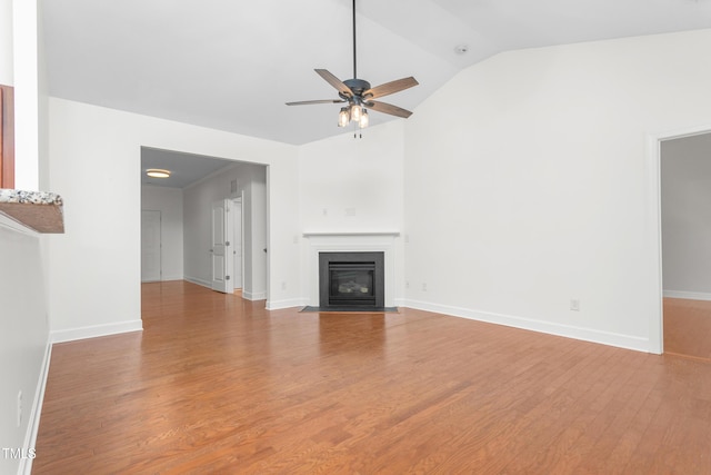 unfurnished living room featuring lofted ceiling, light hardwood / wood-style floors, and ceiling fan