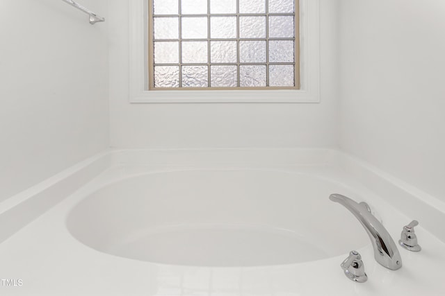 bathroom featuring a tub to relax in