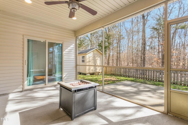 unfurnished sunroom with wood ceiling