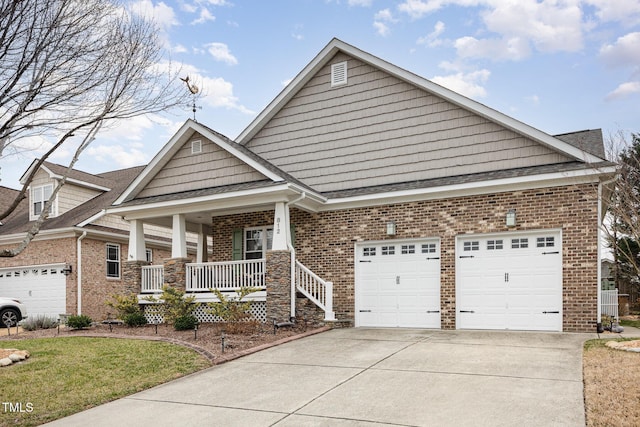 view of front of house with a garage, covered porch, and a front lawn