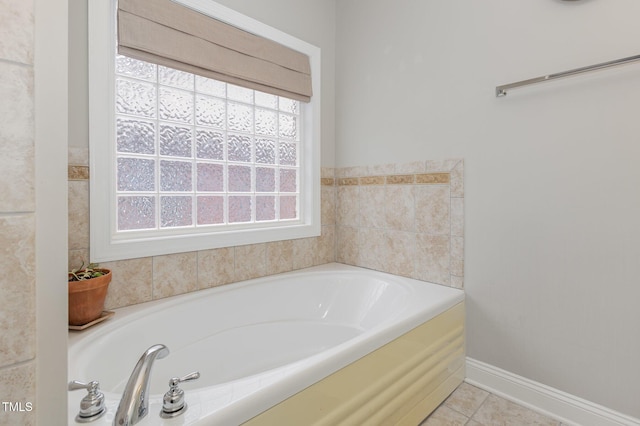 bathroom featuring tile patterned floors and a tub