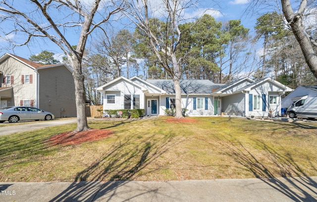 ranch-style home with a front yard