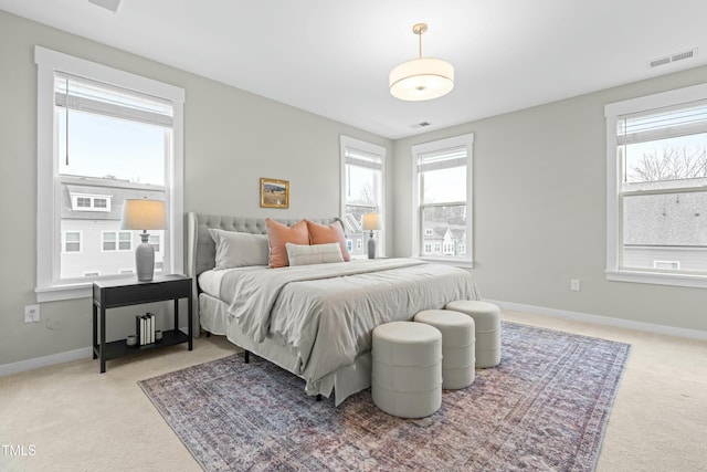 bedroom with light colored carpet