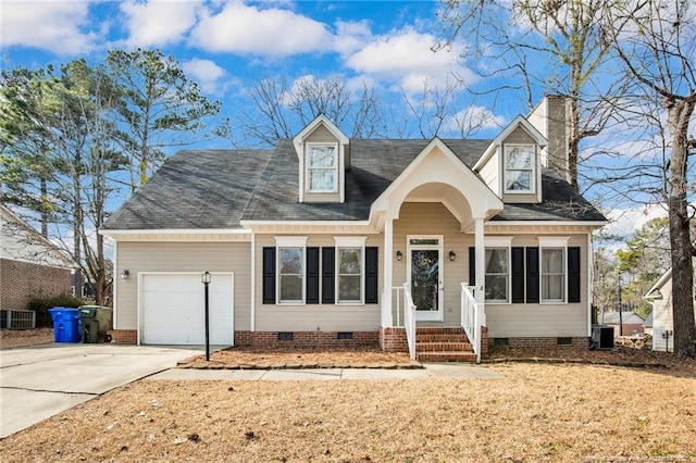 new england style home featuring a garage and central AC unit