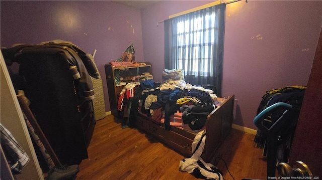 bedroom with hardwood / wood-style flooring