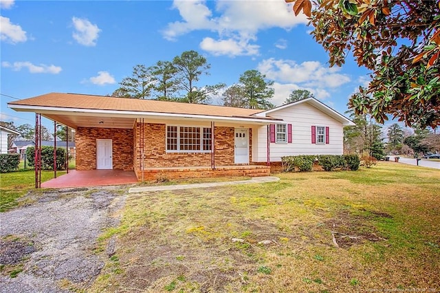 single story home with a carport and a front yard