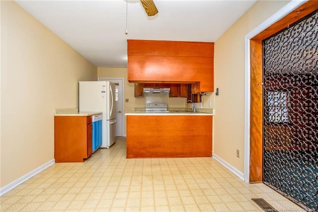 kitchen with white appliances and ceiling fan