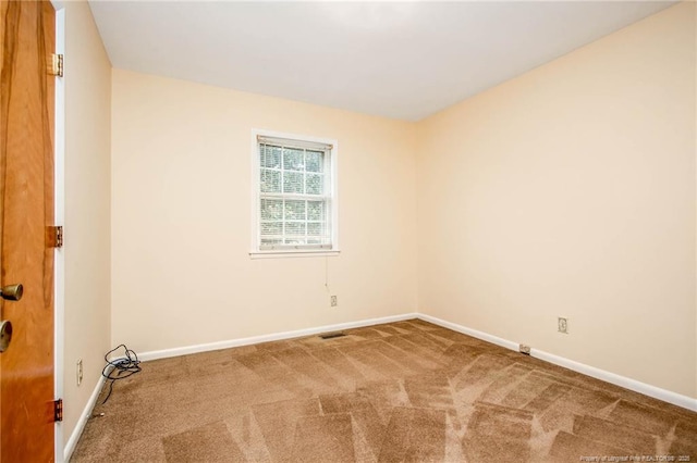 unfurnished room featuring carpet