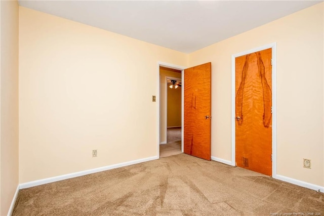 unfurnished bedroom featuring carpet