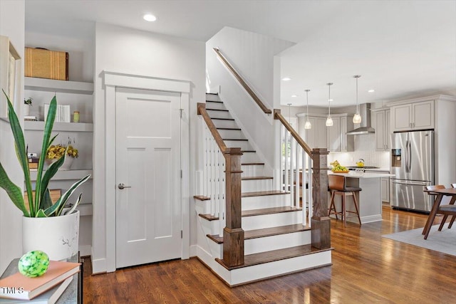 stairway featuring hardwood / wood-style floors