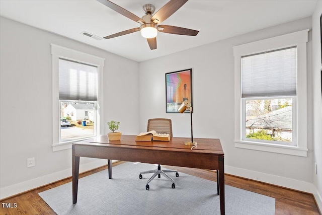 office featuring hardwood / wood-style floors and ceiling fan