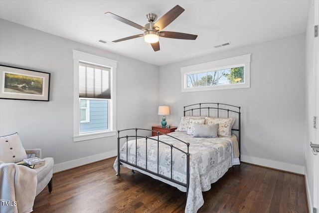 bedroom with dark wood-type flooring and ceiling fan