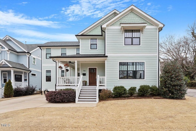 view of front facade with a front yard and covered porch