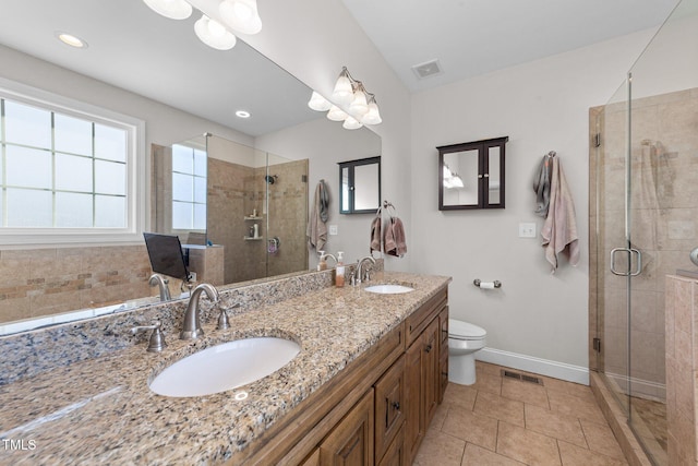 full bath with a sink, visible vents, and a shower stall