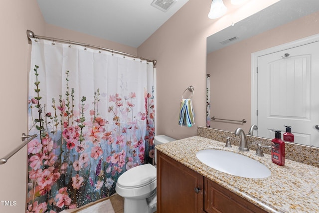 bathroom with a shower with shower curtain, visible vents, vanity, and toilet