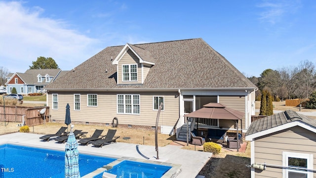 rear view of house featuring a patio, a shingled roof, a gazebo, crawl space, and a fenced backyard