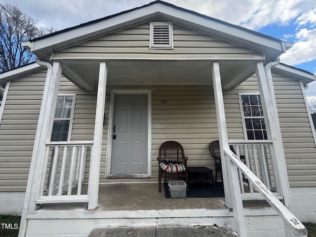 property entrance featuring covered porch