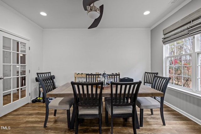 dining room with ceiling fan, ornamental molding, and dark hardwood / wood-style floors