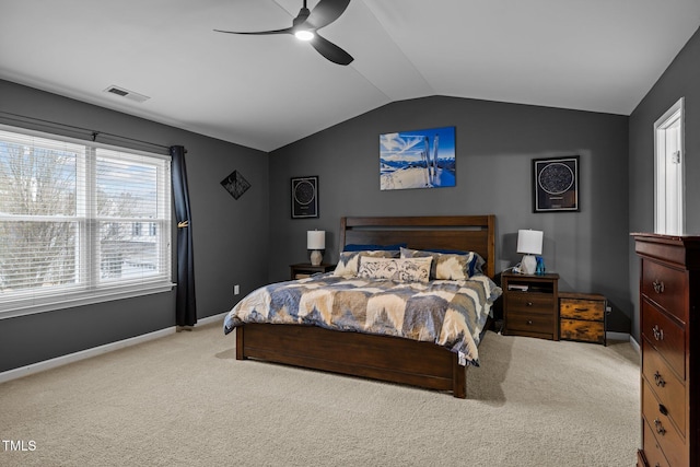 bedroom featuring light carpet, vaulted ceiling, and ceiling fan