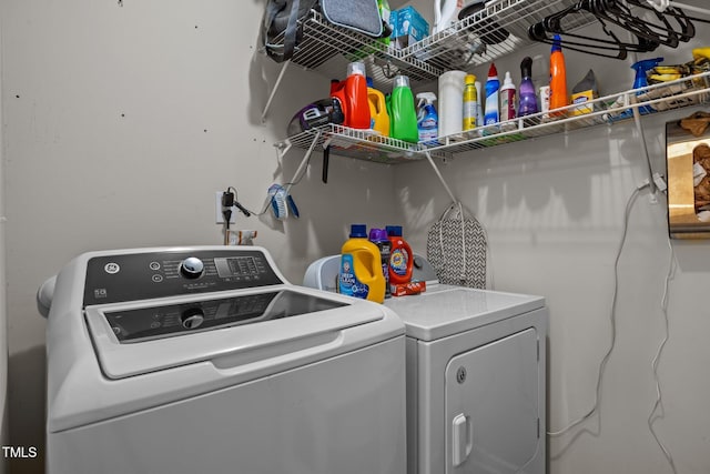 washroom featuring washer and clothes dryer